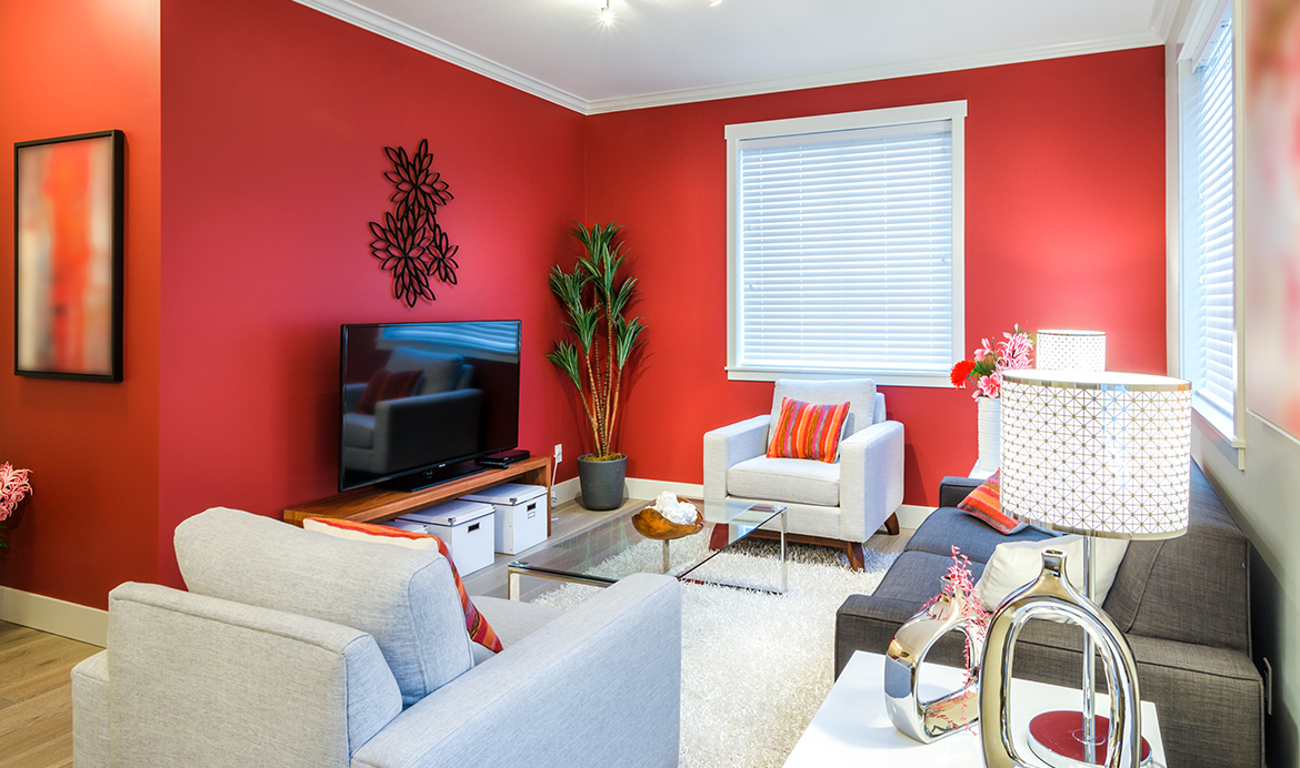 Red living room with white and grey sofa set