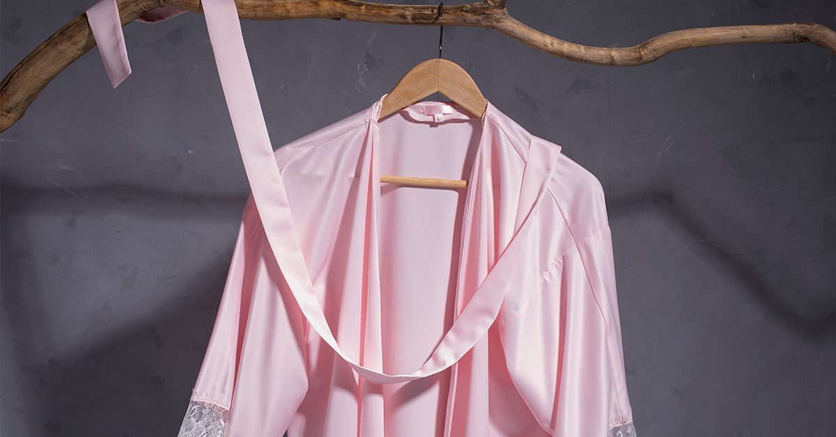 womens pink silk pajamas hanging