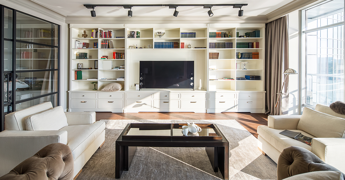 wall-to-floor bookshelf for a television set