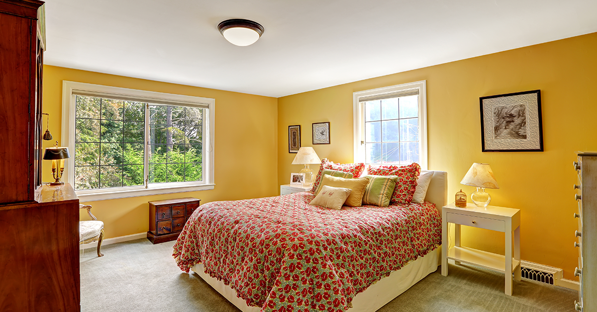 fully furnished modern yellow walls bedroom