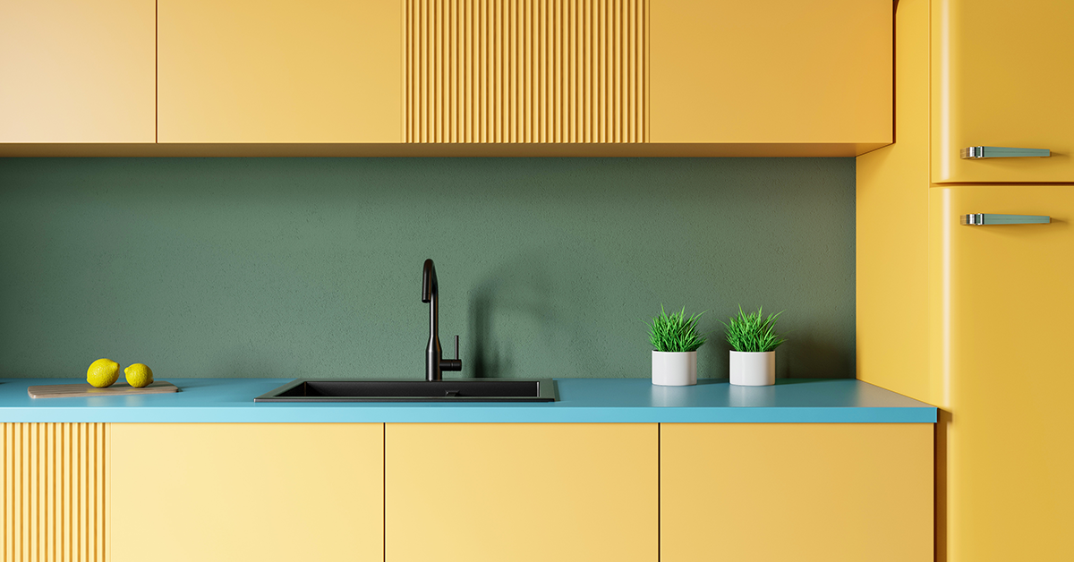 Kitchen painted in yellow, blue and green colour combination
