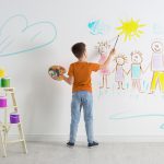 Child drawing on the wall
