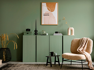Sage green wall with décor