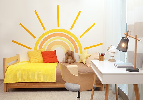 Kids Bedroom With A Sun Painted On The Wall