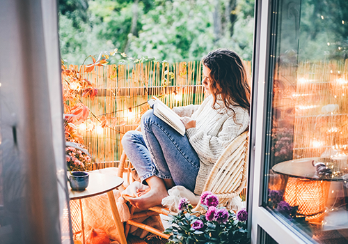 Woman Reading in Balcony